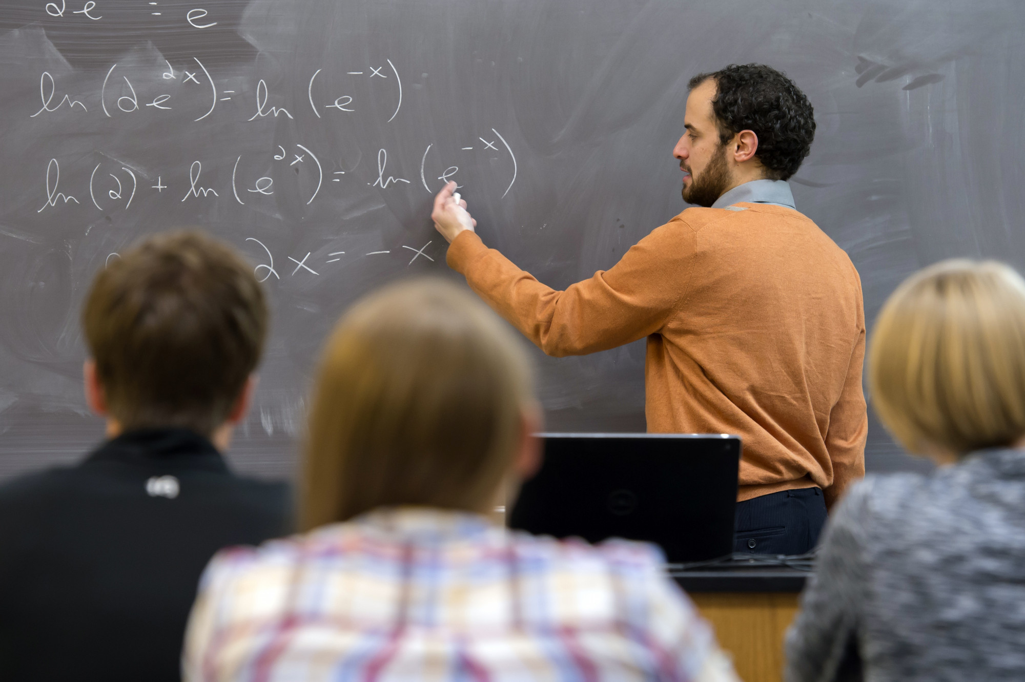 HU professor teaching in a classroom.