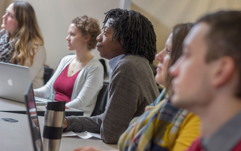 People listening to a lecture.