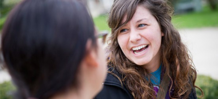 Two HU students talking on campus. 