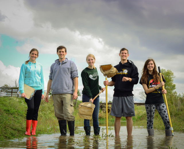 HU students cleaning a water creek. 