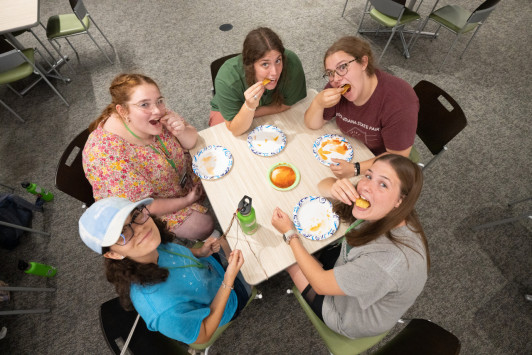 A top down shot of 5 summer nursing camp students.