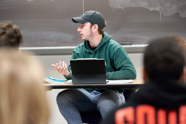 HU students having a conversation in class.