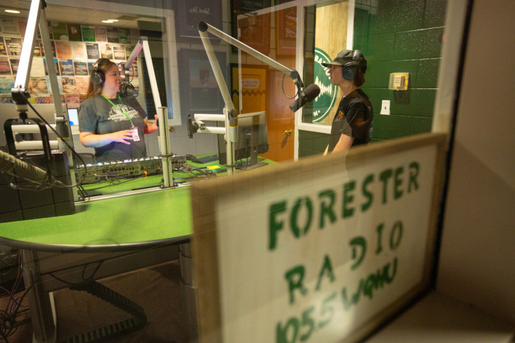 An HU Student and Instructor doing voiceover work at Forester Radio