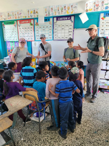 4 people from Huntington University teach a classroom of Guatemalan students.