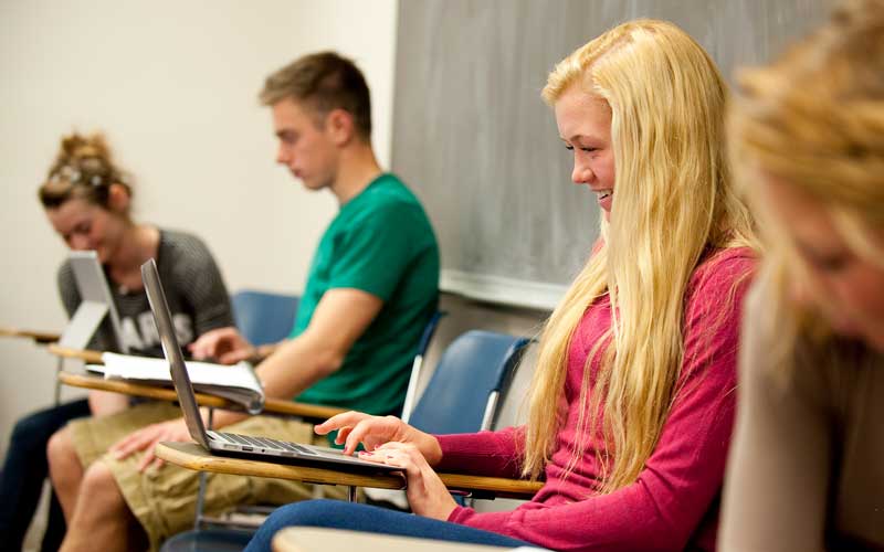 HU students studying in a classroom.